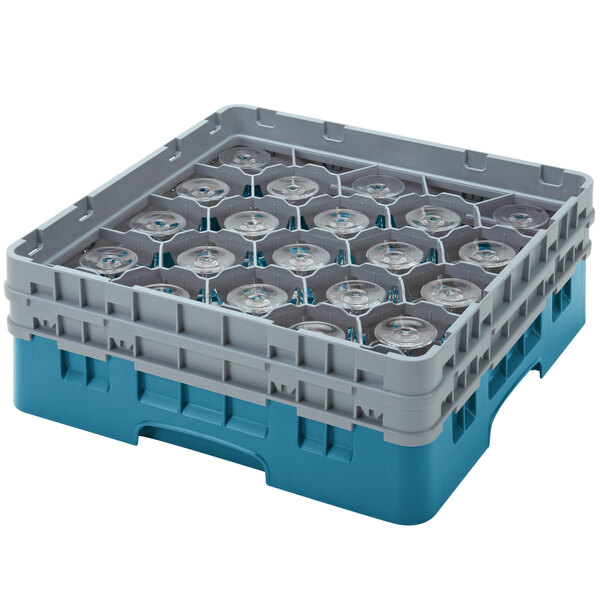 A blue and grey plastic Cambro glass rack with clear cups inside.