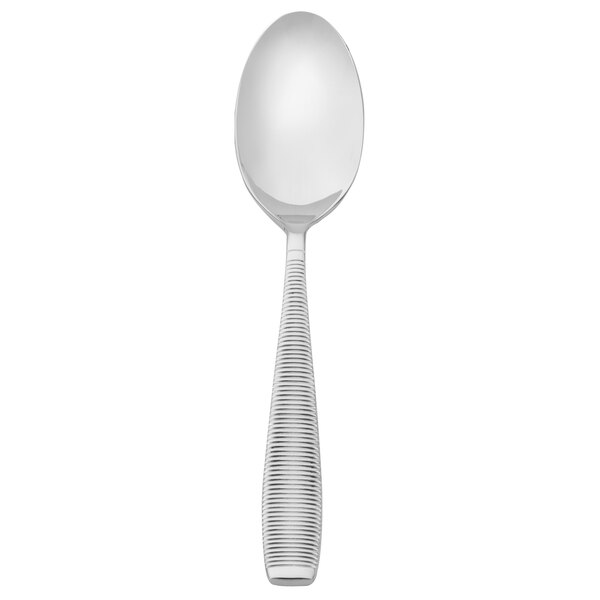 A silver Walco Mastaba serving spoon with a white handle.