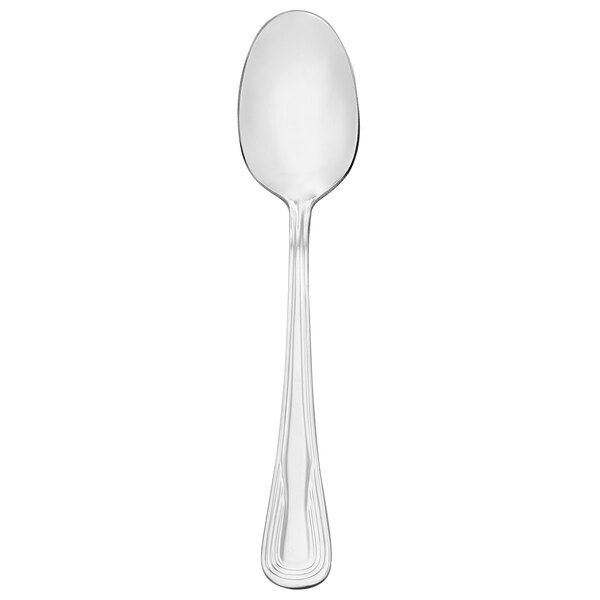 A silver Walco stainless steel dessert spoon.