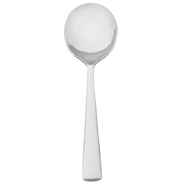 A white Walco Audition bouillon spoon with a silver spoon.