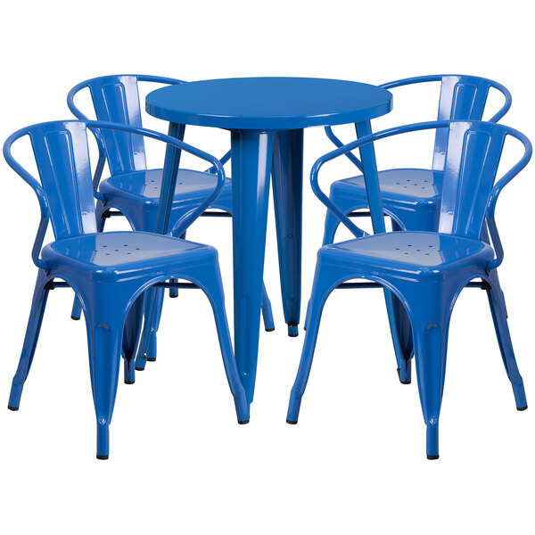 A blue table and chairs set on an outdoor patio.