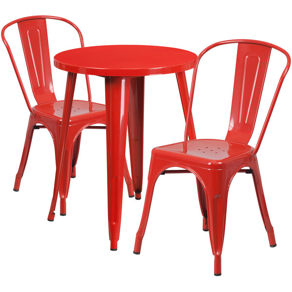 A red metal table and two chairs.