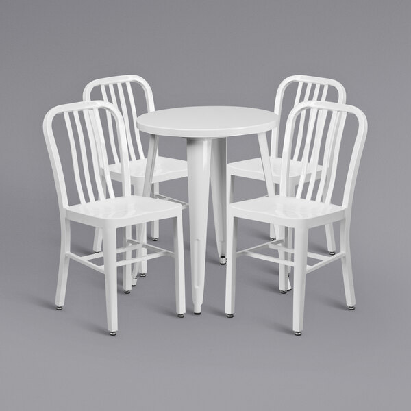 A Flash Furniture white metal table with white chairs around it.