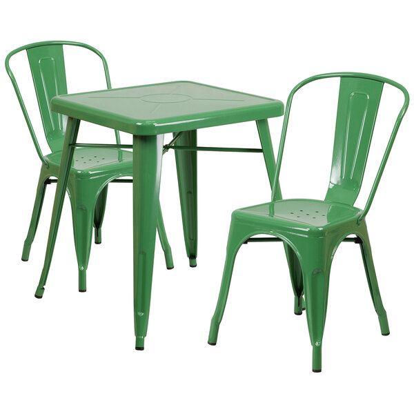 A green metal table and chairs set.