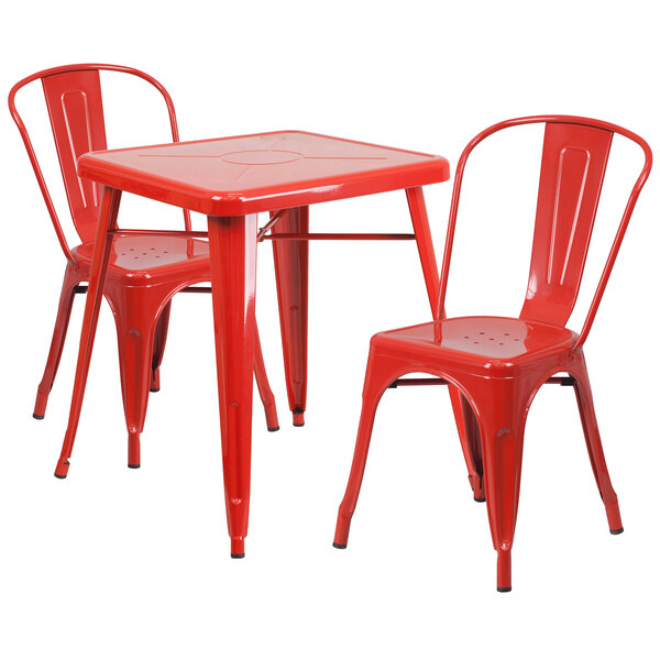 A red metal table and chairs set.