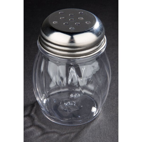 A clear Lexan cheese shaker with a metal top.