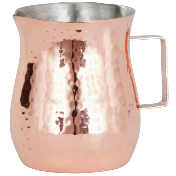 An American Metalcraft copper bell creamer with a handle.