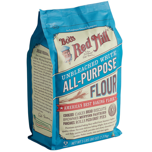 A blue Bob's Red Mill bag of unbleached all-purpose flour.