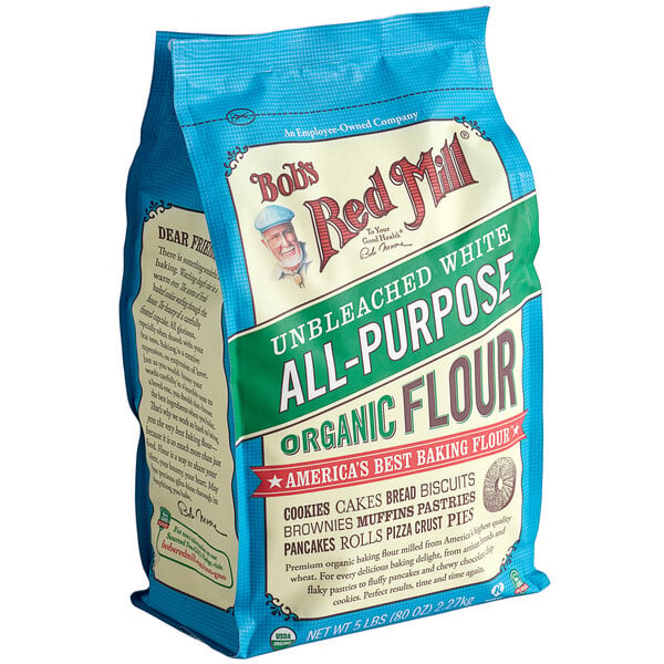 A blue bag of Bob's Red Mill Organic Unbleached All-Purpose Flour.