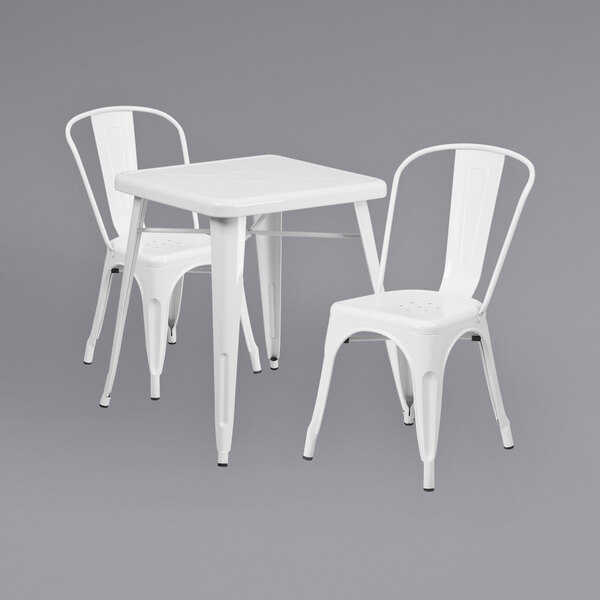 A Flash Furniture white metal table and chair set.