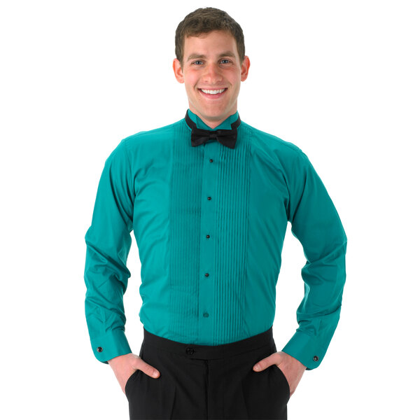 A man wearing a Henry Segal teal tuxedo shirt with a wing tip collar and a black bow tie.