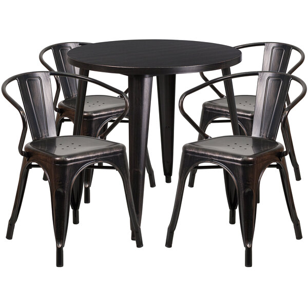A black metal Flash Furniture table with four arm chairs around it.