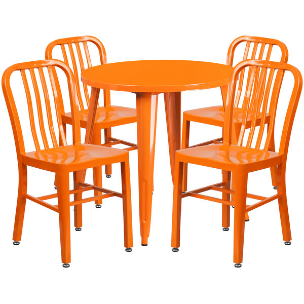 An orange metal Flash Furniture table with four orange chairs.