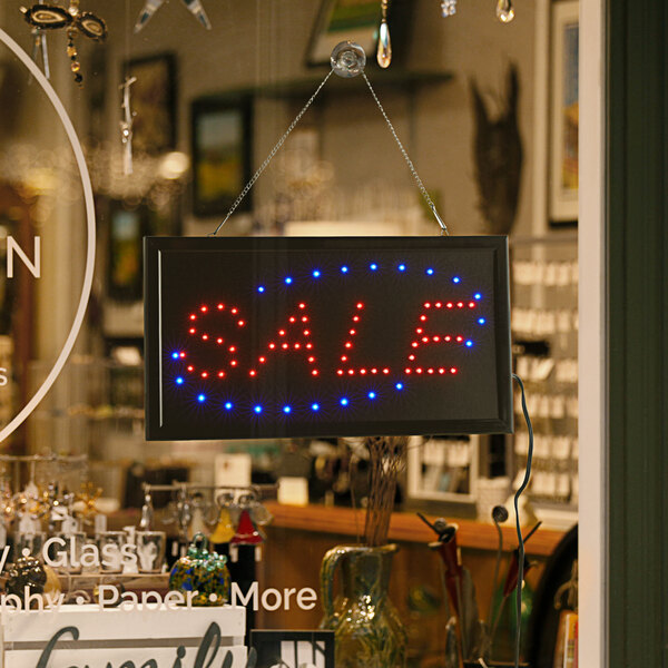 A rectangular LED sale sign with lights on it.