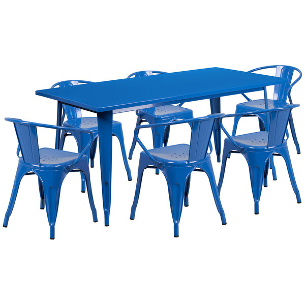A blue rectangular metal dining table with six blue chairs.