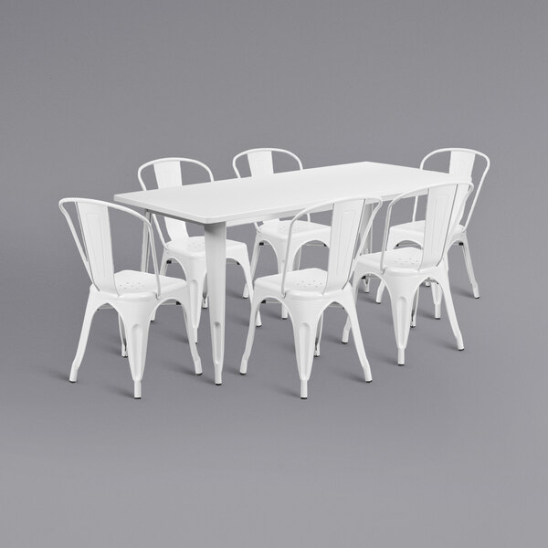 A white rectangular metal table with six white chairs.