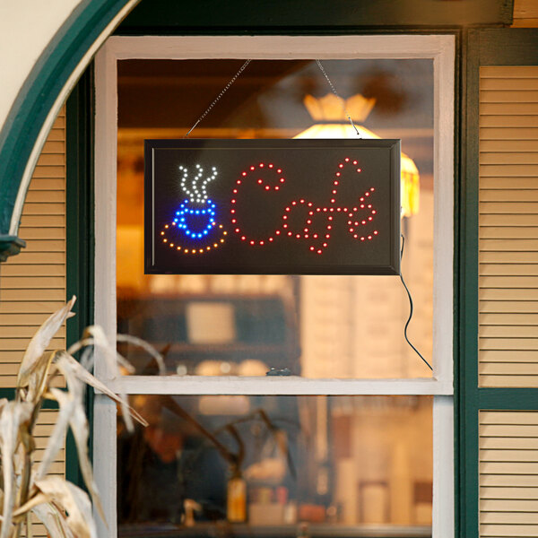 A rectangular LED cafe sign that says "coffee" in a window.