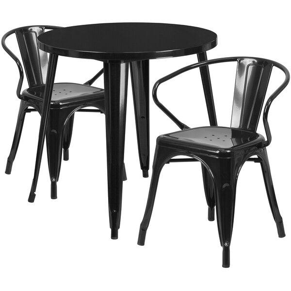A black metal Flash Furniture table with two black metal armchairs.
