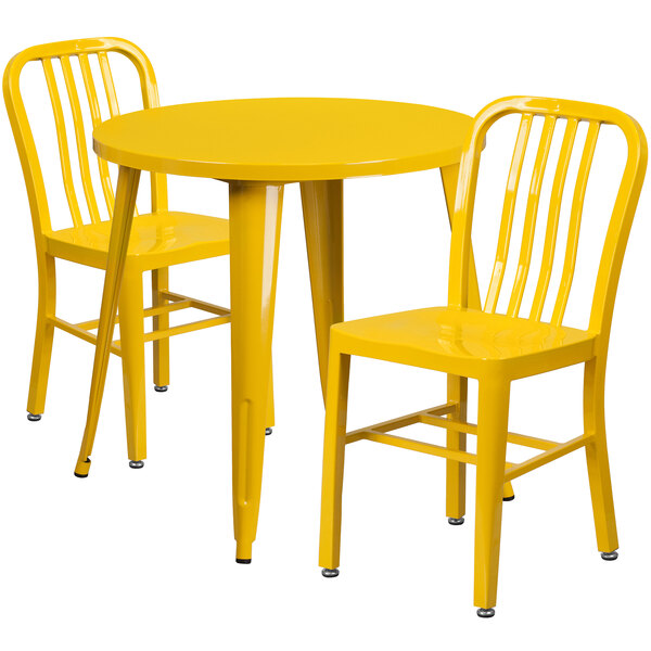 A Flash Furniture yellow metal table and two chairs.