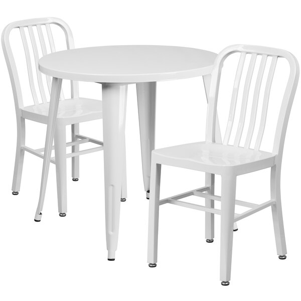 A white metal Flash Furniture table with two chairs.