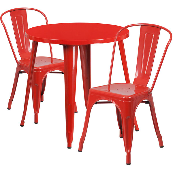 A red metal table and two chairs.