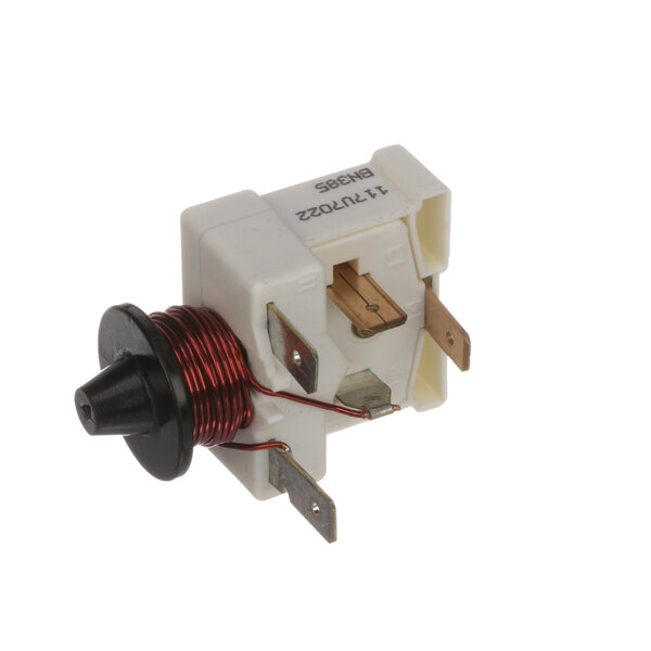 A Delfield 3520009 relay, a small white and red electrical device with wires.