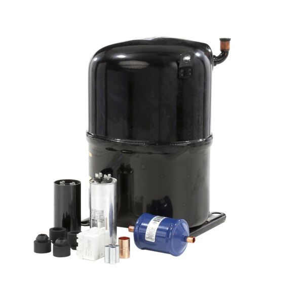 A black Ice-O-Matic compressor with a metal cylinder and other items.
