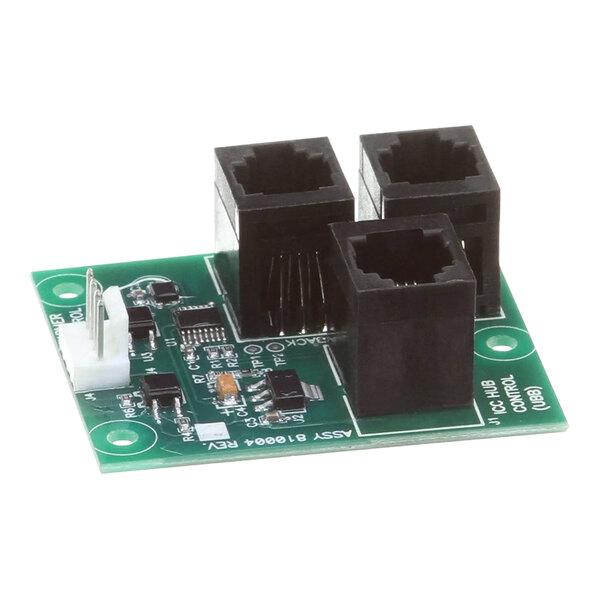 A green circuit board with a black square object.