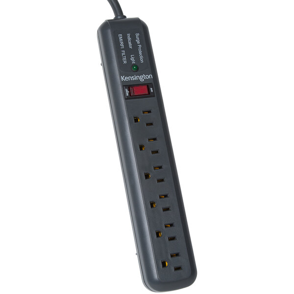 A close-up of a gray Kensington power strip with a red light.