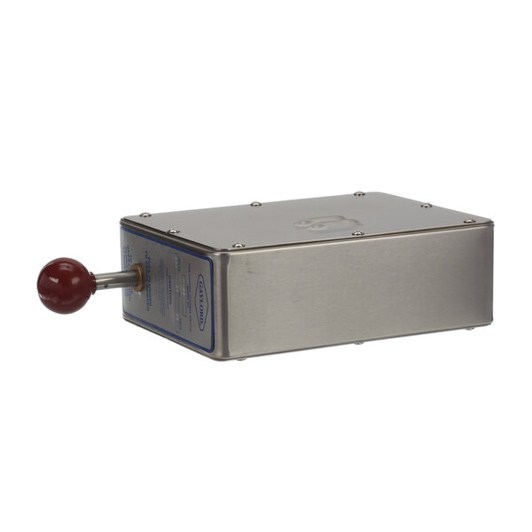 A white metal box with screws and a red button.
