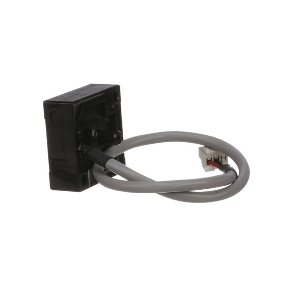 A close-up of a black Rinnai pressure sensor box with a grey cable.