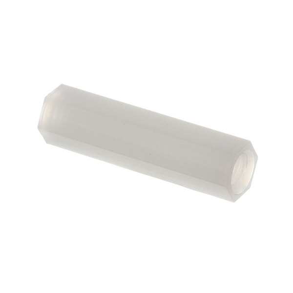A white plastic rectangular spacer with a hexagon inside.