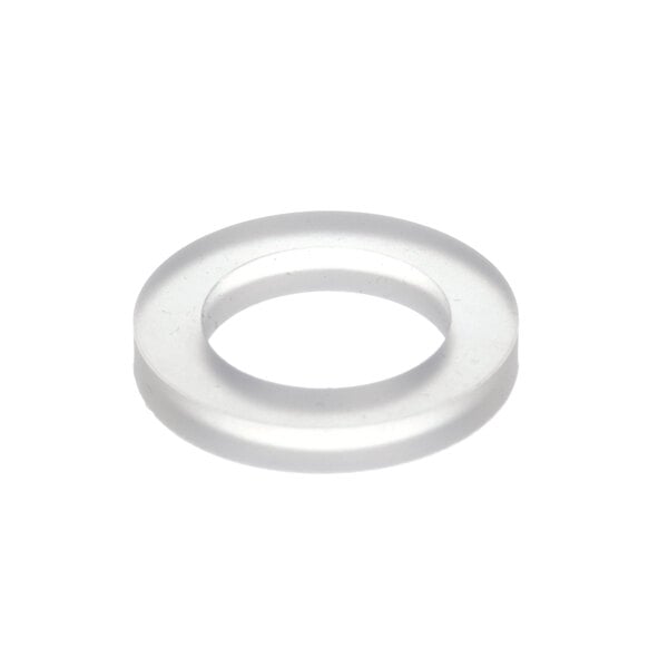 A close-up of a clear plastic gasket with a white circle and a hole in the middle.