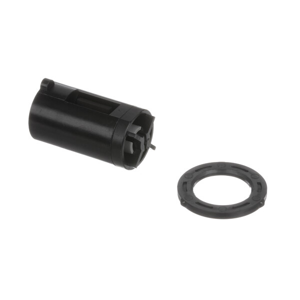 A black cylinder with a round metal ring.