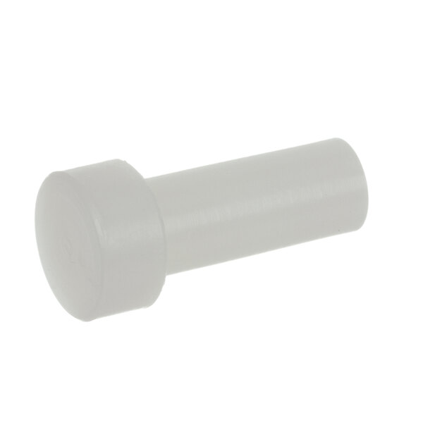A white plastic object with a round cap and a nut.