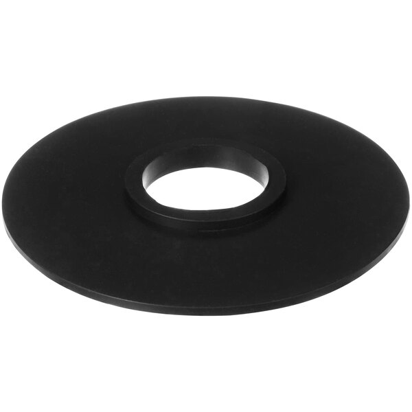 A black rubber flinger with a hole in the center.