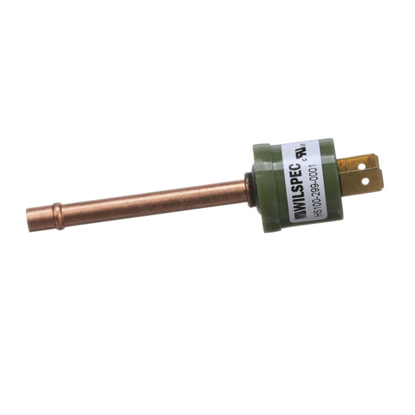 A green and copper pressure switch with a white label.