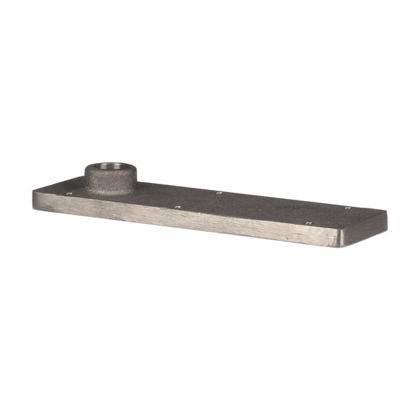 A rectangular metal plate with a hole and a metal handle.