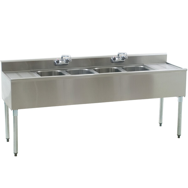 An Eagle Group stainless steel underbar sink with four compartments and two drainboards.