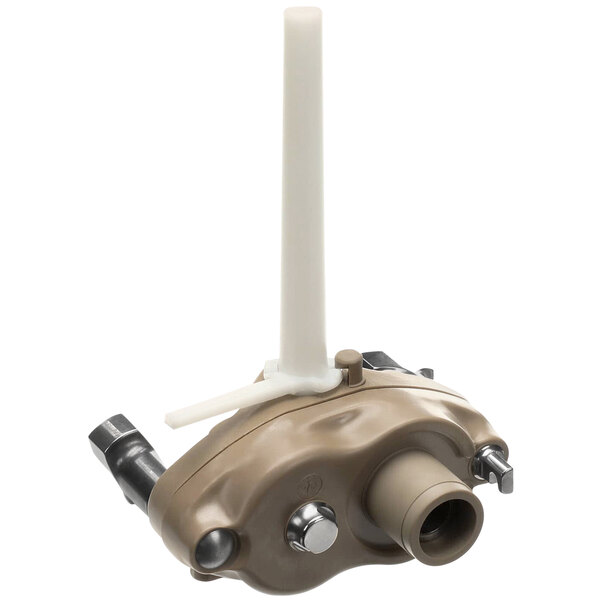 A beige water valve with a white handle on a plastic device.