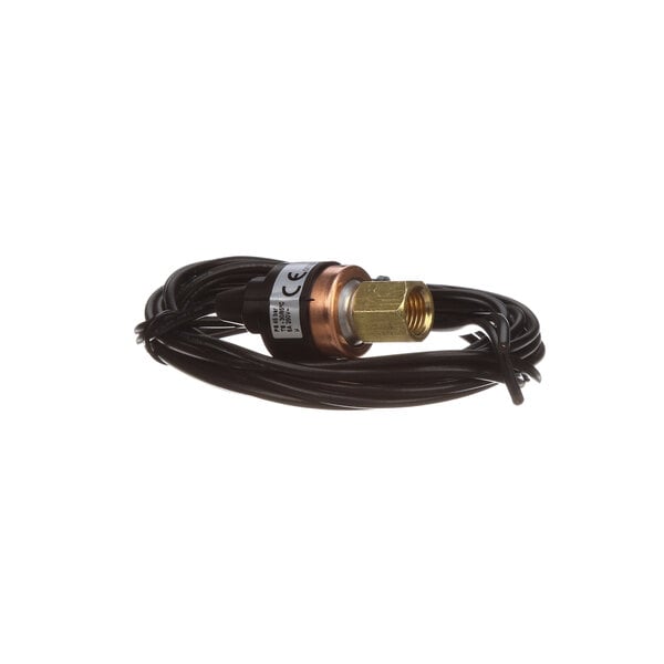 A black cable with a copper connector attached to a brass and copper device.