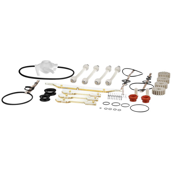 A group of white parts including a white plastic pipe and black hose.