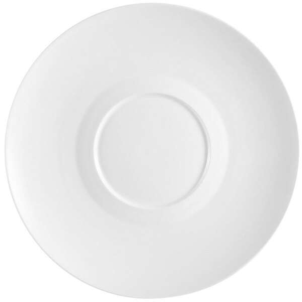 A close-up of a white CAC Paris porcelain plate with a circle in the middle and a small rim.
