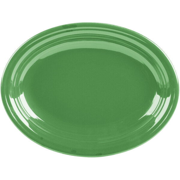 A green oval Fiesta china platter on a white background.