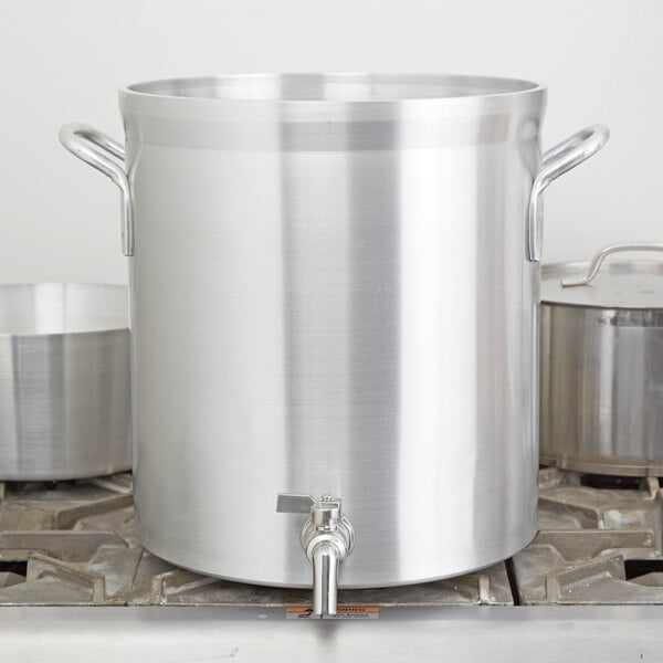 A large silver Vollrath stock pot on a stove.