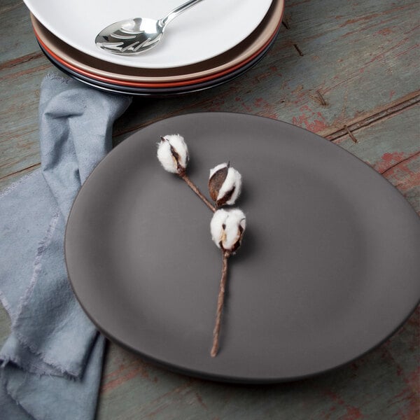 A Libbey Driftstone granite melamine platter with a spoon on it.