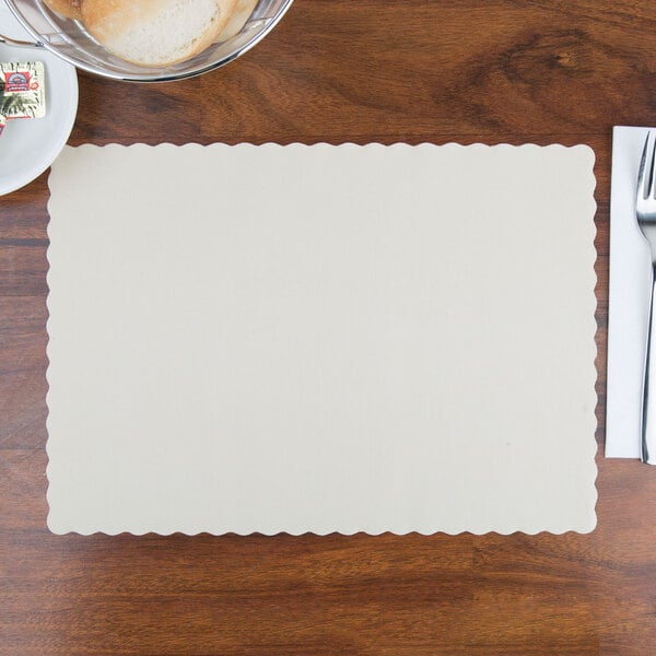 Hoffmaster 310522 10" x 14" Ecru / Ivory Colored Paper Placemat with Scalloped Edge - 1000/Case