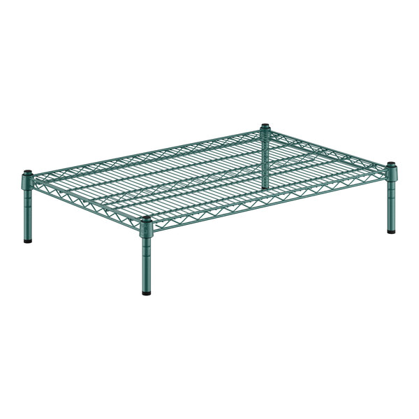 A green wire shelf with metal legs.