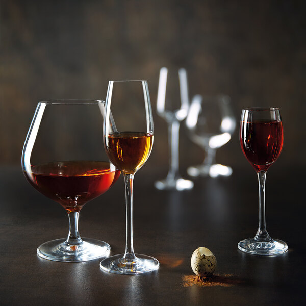 A group of Chef & Sommelier brandy glasses on a table.