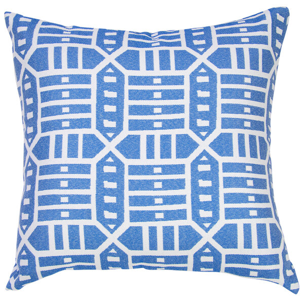 A blue and white pillow with geometric patterns on a outdoor patio chair.